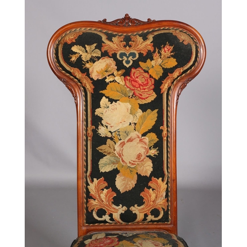 393 - A VICTORIAN WALNUT PRIE DIEU CHAIR, having an encircling frame with foliate cresting, original flora... 