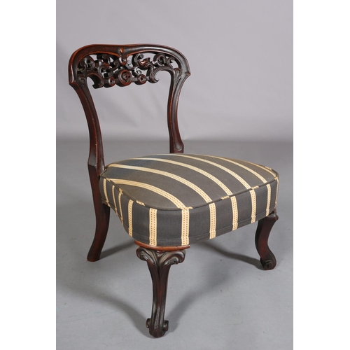 394 - A VICTORIAN MAHOGANY NURSING CHAIR, with pierced foliate carved open back, upholstered seat, on cabr... 