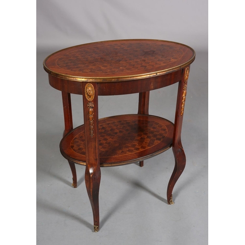 420 - A FRENCH MAHOGANY CROSSBANDED AND PARQUETRY TWO TIER TABLE WITH GILT METAL MOUNTS, of oval outline, ... 