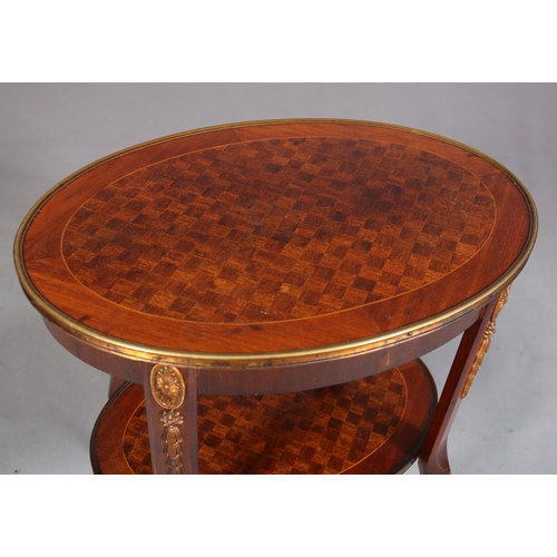 420 - A FRENCH MAHOGANY CROSSBANDED AND PARQUETRY TWO TIER TABLE WITH GILT METAL MOUNTS, of oval outline, ... 