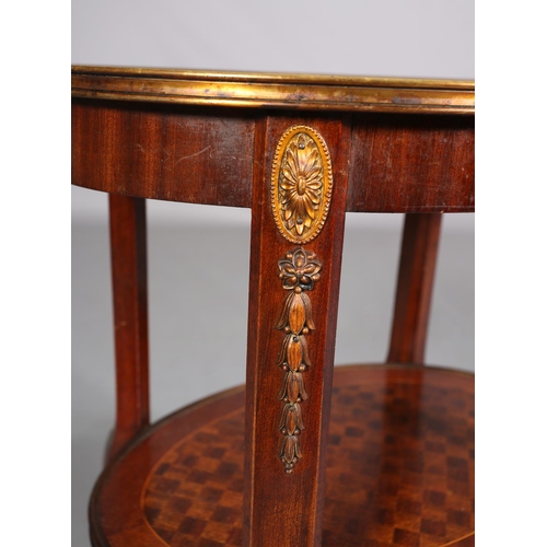 420 - A FRENCH MAHOGANY CROSSBANDED AND PARQUETRY TWO TIER TABLE WITH GILT METAL MOUNTS, of oval outline, ... 