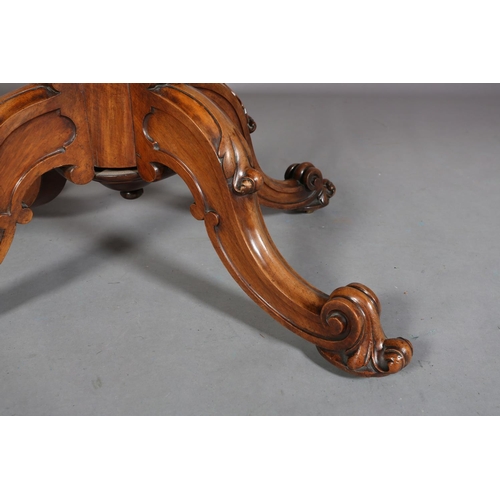 414 - A VICTORIAN FIGURED WALNUT LOOE TABLE, oval, having a quarter veneer tilt top, on a turned and beade... 