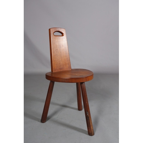 350 - THOMPSON OF KILBURN 'MOUSEMAN', an oak spinning chair the tapered back with finger grip, on three ch... 