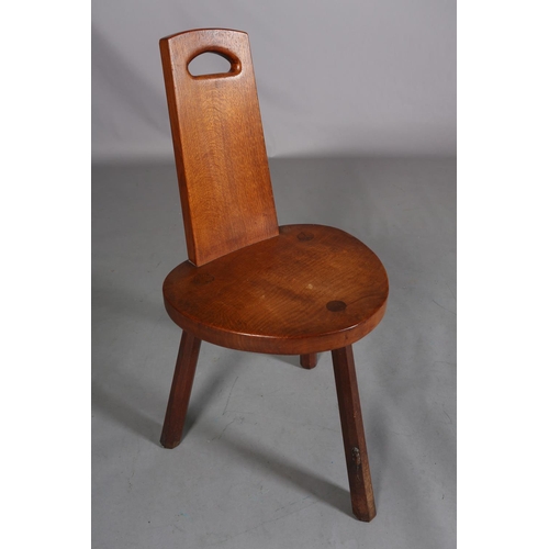 350 - THOMPSON OF KILBURN 'MOUSEMAN', an oak spinning chair the tapered back with finger grip, on three ch... 