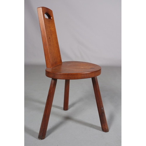 350 - THOMPSON OF KILBURN 'MOUSEMAN', an oak spinning chair the tapered back with finger grip, on three ch... 