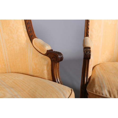 416 - A PAIR OF LOUIS XVI-STYLE BERGERES, having a riband carved encircling frame with ribbon cresting, up... 