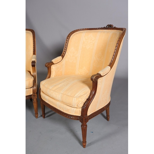 416 - A PAIR OF LOUIS XVI-STYLE BERGERES, having a riband carved encircling frame with ribbon cresting, up... 