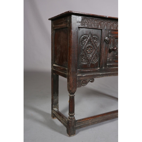 359 - AN OAK CUPBOARD OF 17TH CENTURY STYLE, of narrow proportions, gouge cut ends to the top, above a dem... 