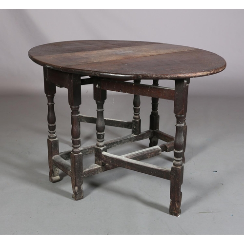 360 - AN 18TH CENTURY OAK GATELEG SUPPER TABLE, having twin oval drop leaves on baluster turned and square... 