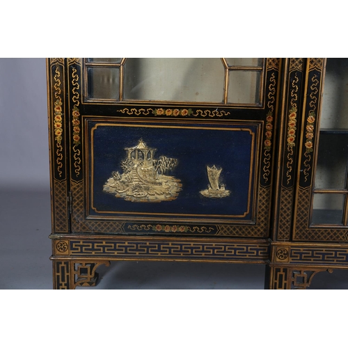 388 - AN EBONISED AND GILT CHINOISERIE BREAKFRONT BOOKCASE CABINET, the top gilded with island vignette ab... 