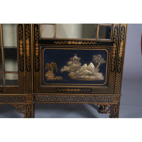 388 - AN EBONISED AND GILT CHINOISERIE BREAKFRONT BOOKCASE CABINET, the top gilded with island vignette ab... 