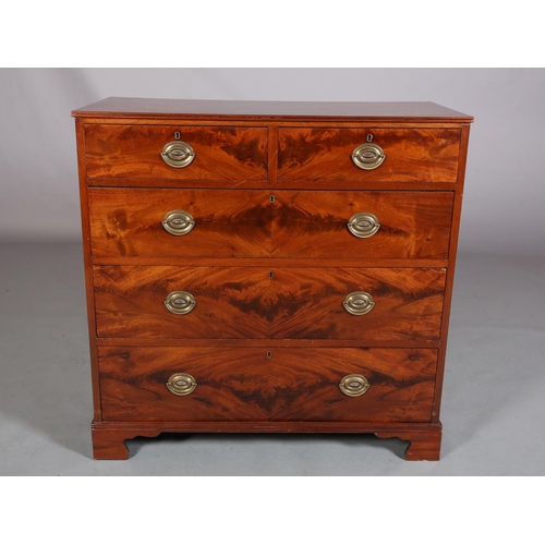 399 - A GEORGE III-STYLE FIGURED MAHOGANY CHEST of two short and three long graduated drawers, later brass... 