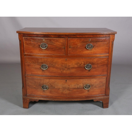 378 - A GEORGE III MAHOGANY BOWFRONT CHEST of two short and two long cockbeaded drawers, brass oval back p... 