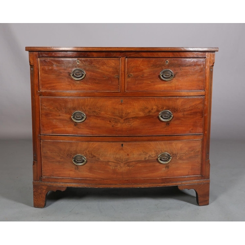 378 - A GEORGE III MAHOGANY BOWFRONT CHEST of two short and two long cockbeaded drawers, brass oval back p... 