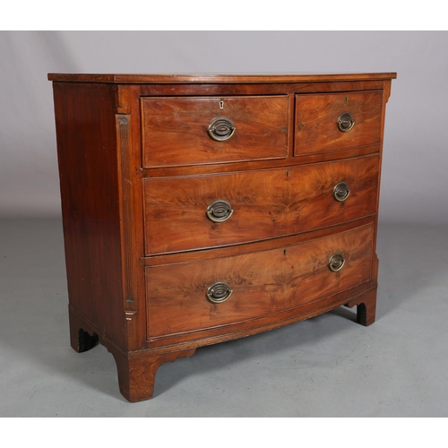 378 - A GEORGE III MAHOGANY BOWFRONT CHEST of two short and two long cockbeaded drawers, brass oval back p... 