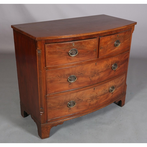 378 - A GEORGE III MAHOGANY BOWFRONT CHEST of two short and two long cockbeaded drawers, brass oval back p... 