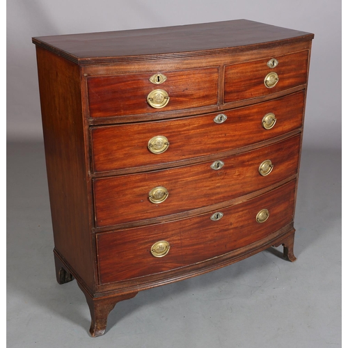 380 - A LATE GEORGE III MAHOGANY BOW FRONTED CHEST of two short and three long graduated cockbeaded drawer... 