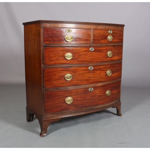 380 - A LATE GEORGE III MAHOGANY BOW FRONTED CHEST of two short and three long graduated cockbeaded drawer... 