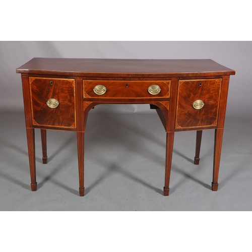 379 - A LATE GEORGE III MAHOGANY AND SATINWOOD BANDED SIDEBOARD of bowed outline, having a drawer to the c... 