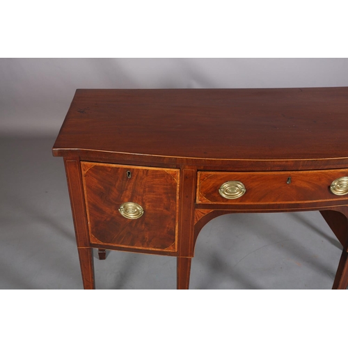 379 - A LATE GEORGE III MAHOGANY AND SATINWOOD BANDED SIDEBOARD of bowed outline, having a drawer to the c... 