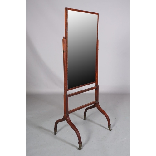 411 - A LATE GEORGE III MAHOGANY CHEVAL MIRROR, having a rectangular glass, on square uprights and twin re... 