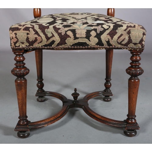 412 - A CAROLEAN WALNUT SIDE CHAIR, having a pierced panel back and cresting carved with face mask and lea... 