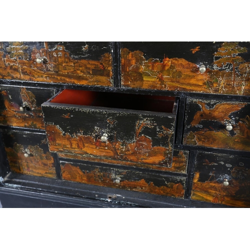 413 - AN EBONISED DECOUPAGE CABINET ON STAND, having two doors, the interior fitted with an arrangement of... 