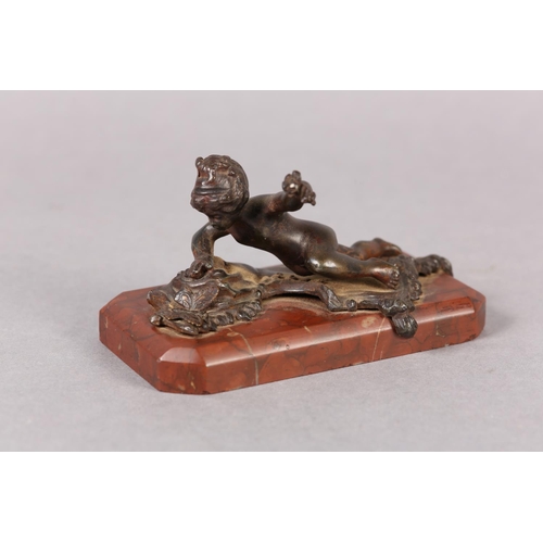 61 - A LATE 19TH CENTURY COLD PAINTED BRONZE FIGURE of an infant girl and butterfly, on red marble base, ... 