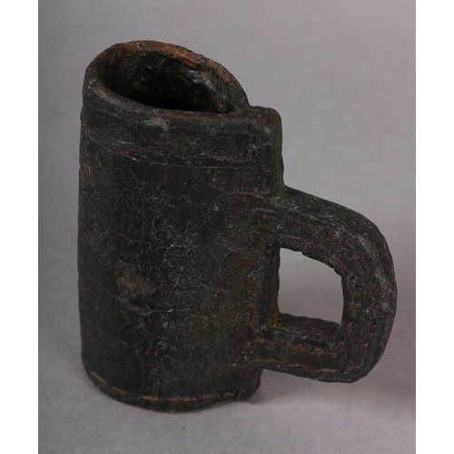 25 - A LEATHER BLACKJACK ALE TANKARD, of narrow form, 13.5cm high (Shipping category B)