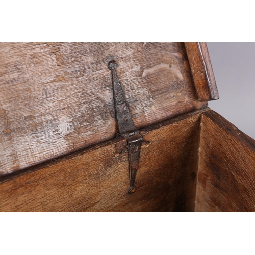 33 - A 19TH CENTURY OAK BOX, having period strap hinges with engraved brass escutcheon and key, 38cm wide... 