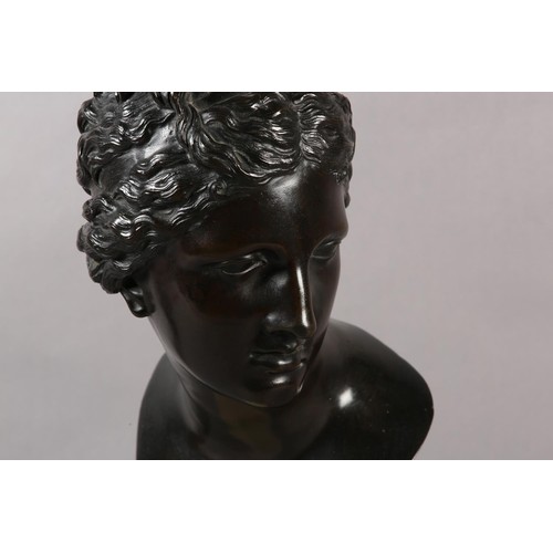 64 - AN 19TH CENTURY BRONZE BUST OF A CLASSICAL FEMALE, after the antique, on marble socle, 49cm high