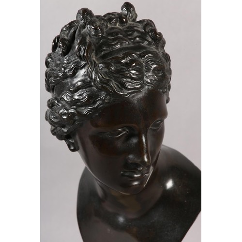 64 - AN 19TH CENTURY BRONZE BUST OF A CLASSICAL FEMALE, after the antique, on marble socle, 49cm high