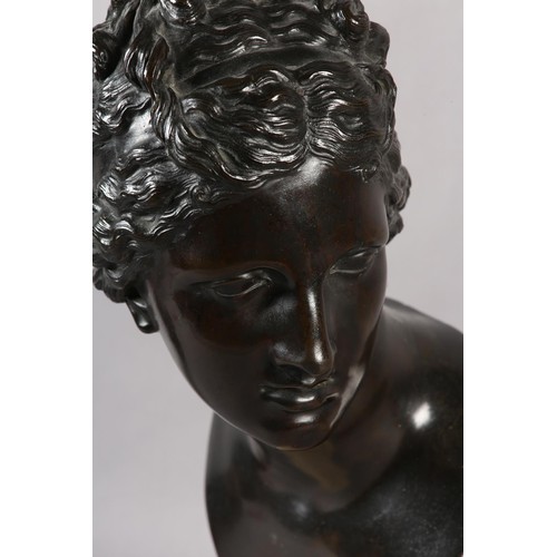 64 - AN 19TH CENTURY BRONZE BUST OF A CLASSICAL FEMALE, after the antique, on marble socle, 49cm high