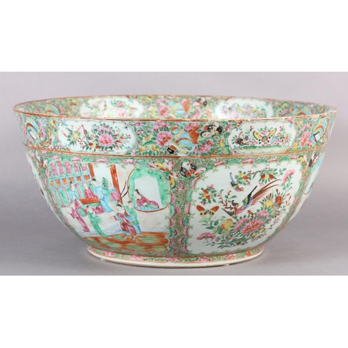 109 - AN EXCEPTIONALLY LARGE CANTON FAMILLE ROSE PUNCH BOWL, 19th century, painted with dignitaries and la... 