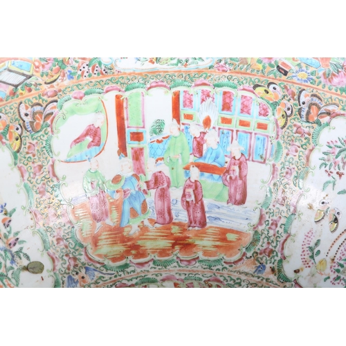 109 - AN EXCEPTIONALLY LARGE CANTON FAMILLE ROSE PUNCH BOWL, 19th century, painted with dignitaries and la... 