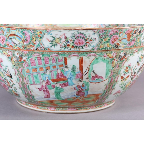 109 - AN EXCEPTIONALLY LARGE CANTON FAMILLE ROSE PUNCH BOWL, 19th century, painted with dignitaries and la... 