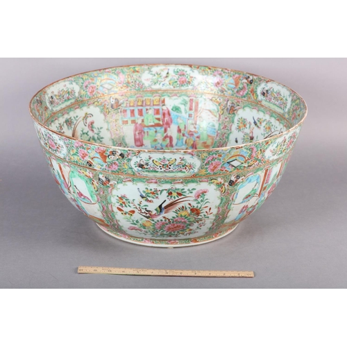 109 - AN EXCEPTIONALLY LARGE CANTON FAMILLE ROSE PUNCH BOWL, 19th century, painted with dignitaries and la... 