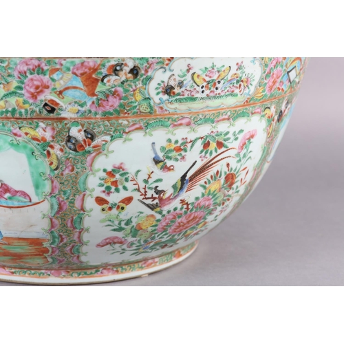 109 - AN EXCEPTIONALLY LARGE CANTON FAMILLE ROSE PUNCH BOWL, 19th century, painted with dignitaries and la... 