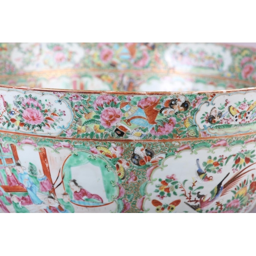 109 - AN EXCEPTIONALLY LARGE CANTON FAMILLE ROSE PUNCH BOWL, 19th century, painted with dignitaries and la... 