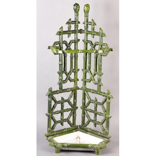 26 - AN AESTHETIC MOVEMENT CAST IRON STICK STAND, cast as bamboo, in pale green glaze with drip tray to b... 