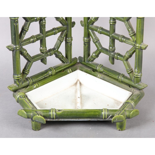 26 - AN AESTHETIC MOVEMENT CAST IRON STICK STAND, cast as bamboo, in pale green glaze with drip tray to b... 