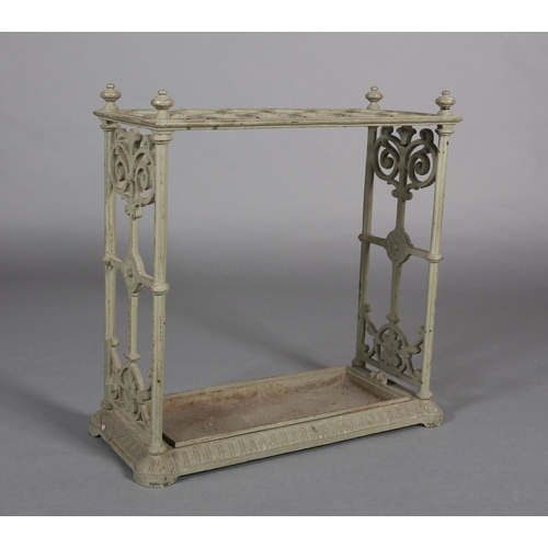 27 - A CAST IRON UMBRELLA STAND with fretwork end panels and four knopped corners, 62cm x 61cm