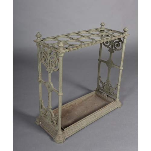 27 - A CAST IRON UMBRELLA STAND with fretwork end panels and four knopped corners, 62cm x 61cm