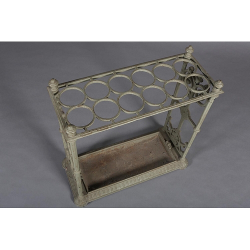 27 - A CAST IRON UMBRELLA STAND with fretwork end panels and four knopped corners, 62cm x 61cm