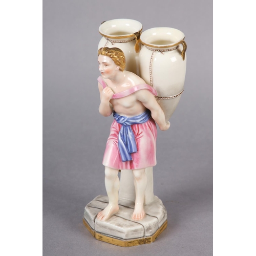 87 - A ROYAL WORCESTER FIGURE OF A CLASSICAL MALE WATER CARRIER, carrying two amphora vases on his back, ... 