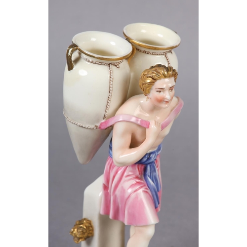 87 - A ROYAL WORCESTER FIGURE OF A CLASSICAL MALE WATER CARRIER, carrying two amphora vases on his back, ... 