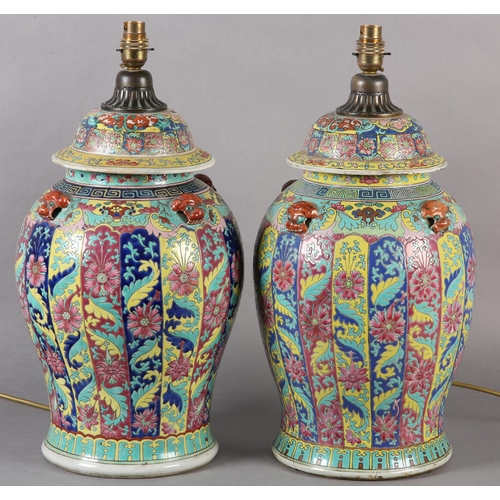 119 - A MATCHED PAIR OF CHINESE FAMILLE ROSE VASES AS TABLE LAMPS, Qing, having domed cover, with applied ... 