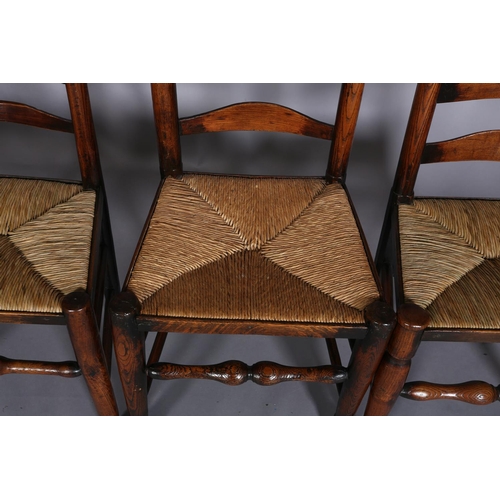 362 - FOUR EARLY 19TH CENTURY LANCASHIRE ASH LADDER BACK CHAIRS, the shaped top rails and curved bars abov... 