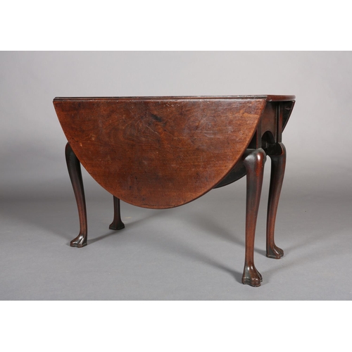 370 - A GEORGE III MAHOGANY PEMBROKE DINING TABLE, oval, having twin drop leaves, arched apron, on cabriol... 