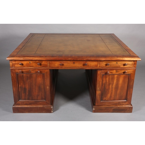 371 - A 19TH CENTURY FIGURED MAHOGANY PARTNER'S DESK, c1830, having a green leather incised writing surfac... 